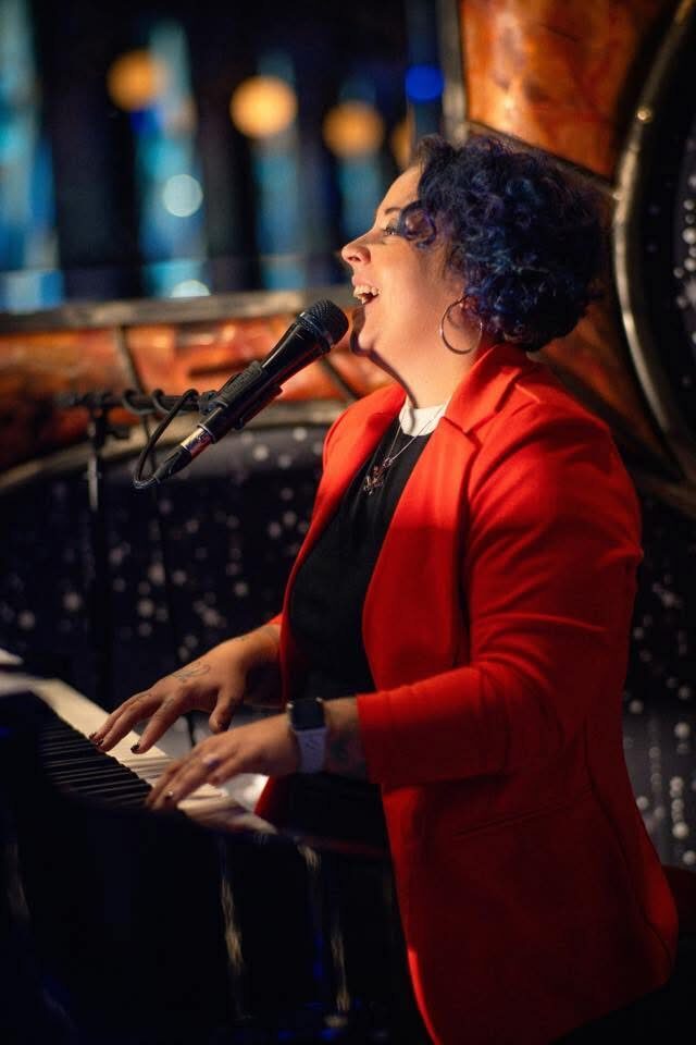 Cassandra Kaczor performing on piano and vocals